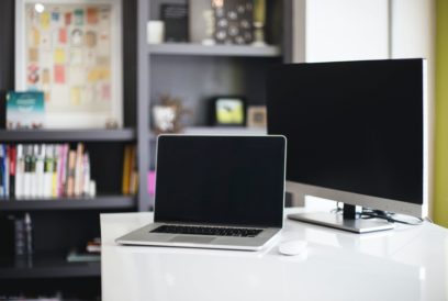 Laptop and monitor in a modern office setting